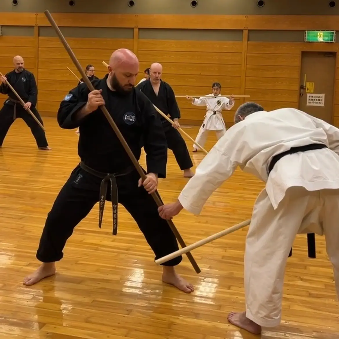 Olgun Tiltay in Nagoya Japan learning Bo [Staff] from Hideki Yamada Sensei [9th Dan Shorin-Ryu Karate]